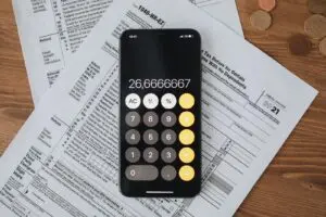 A calculator on tax forms, illustrating the paperwork behind tax debt relief offers