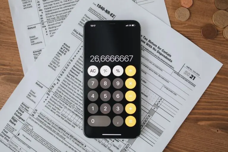 A calculator on tax forms, illustrating the paperwork behind tax debt relief offers