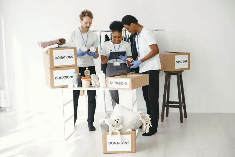 Volunteers sorting donation boxes, the kind of giving people check a charity before supporting