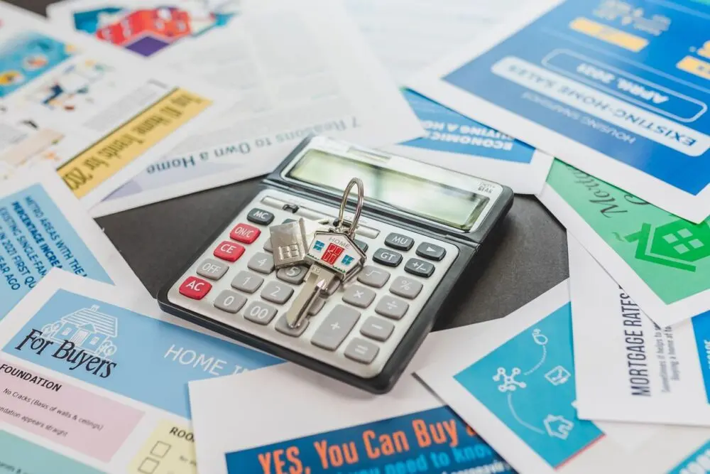 Calculator on top of home-buying flyers, used to work out how much house I can afford