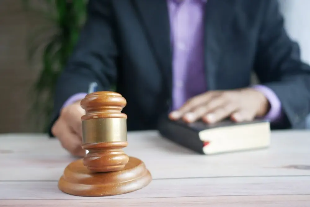Gavel and legal book on a desk, illustrating the court-supervised sale in the Character.AI bankruptcy