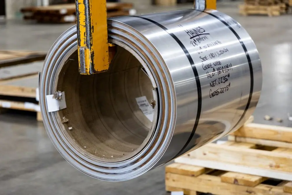 A large steel coil lifted in a warehouse, a cost GM flagged in the GM Q3 results