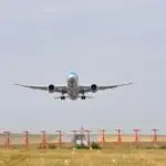 Wide body airplane taking off from a runway ahead of United Airlines earnings