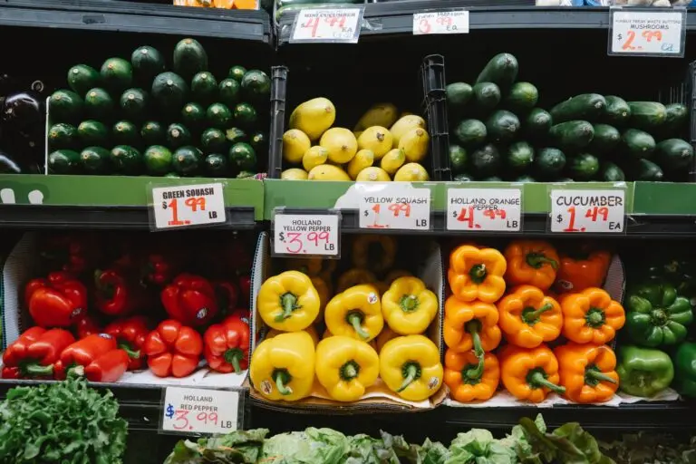 Supermarket produce shelves with peppers, squash and cucumbers, illustrating the Sprouts earnings story
