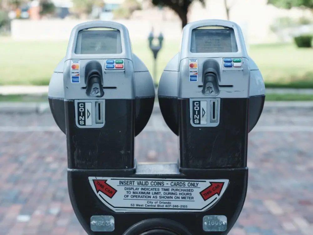 Parking meters with card payment options, illustrating where a QR code scam can appear