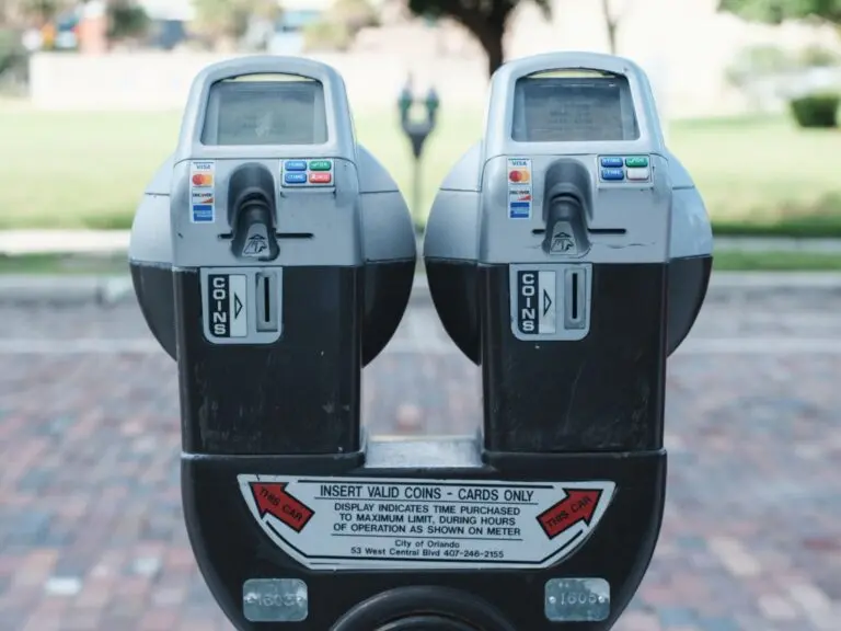 Parking meters with card payment options, illustrating where a QR code scam can appear